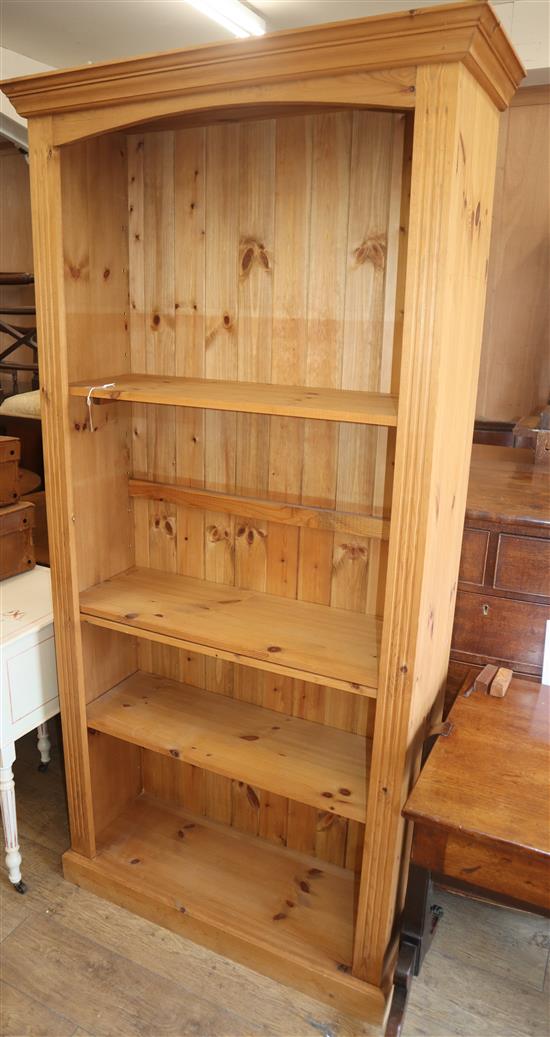 A reproduction tall pine open bookcase W.94cm